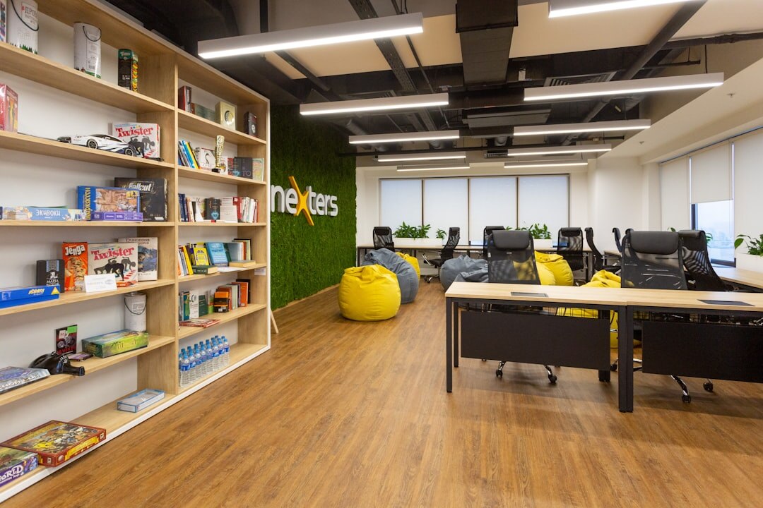 Modern editorial newsroom office interior with desks and screens