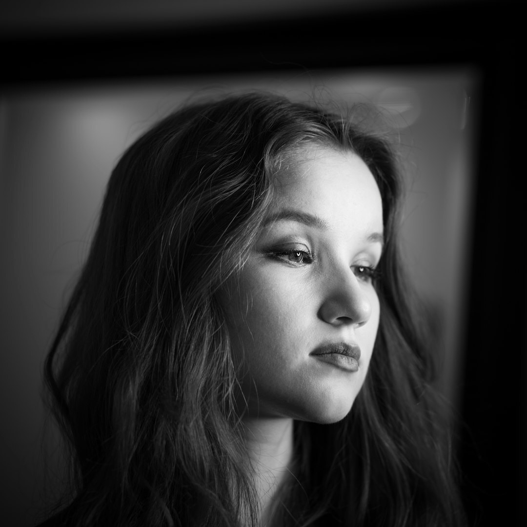 Studio portrait of a young woman photo editor
