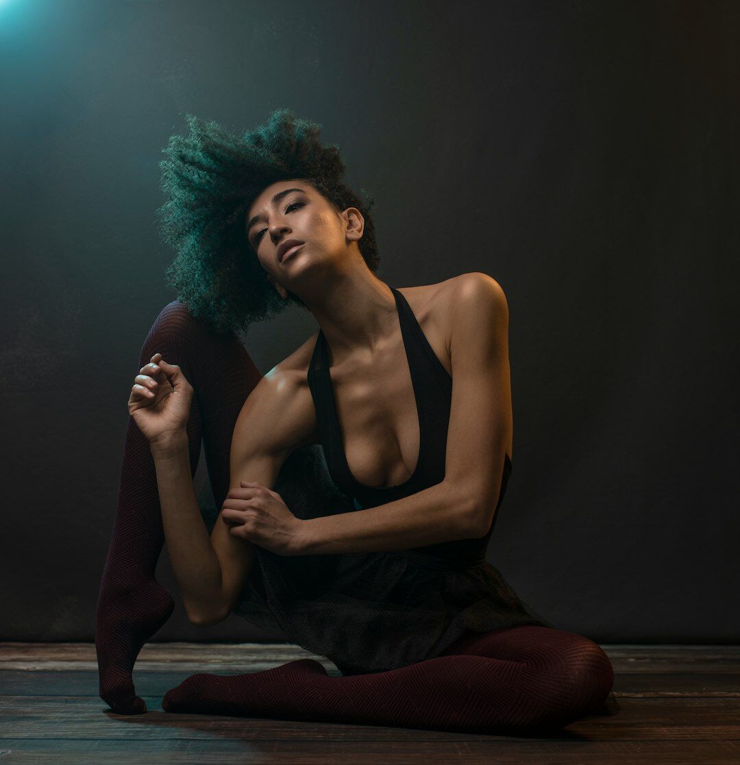 Fashion model posing in an elegant evening gown in a studio